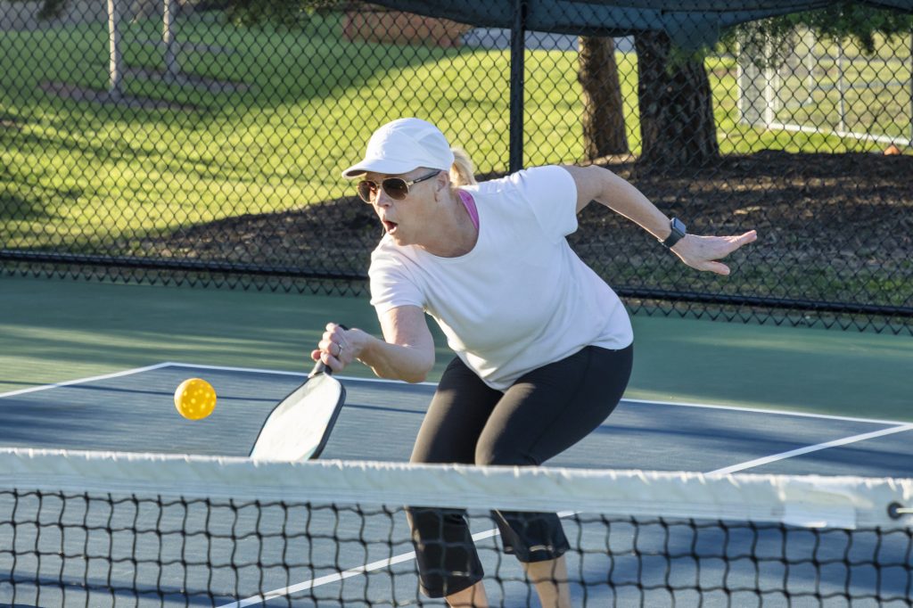 Close-up view of a pickleball net stretched across a court