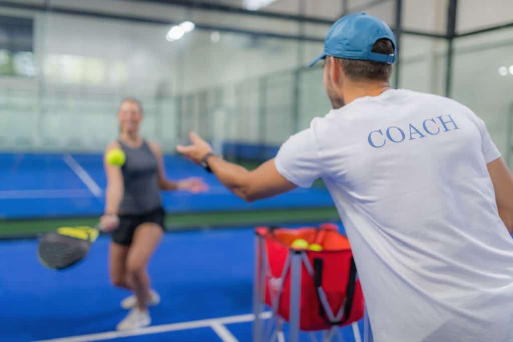 Group of players performing side-to-side shuffles on a pickleball court